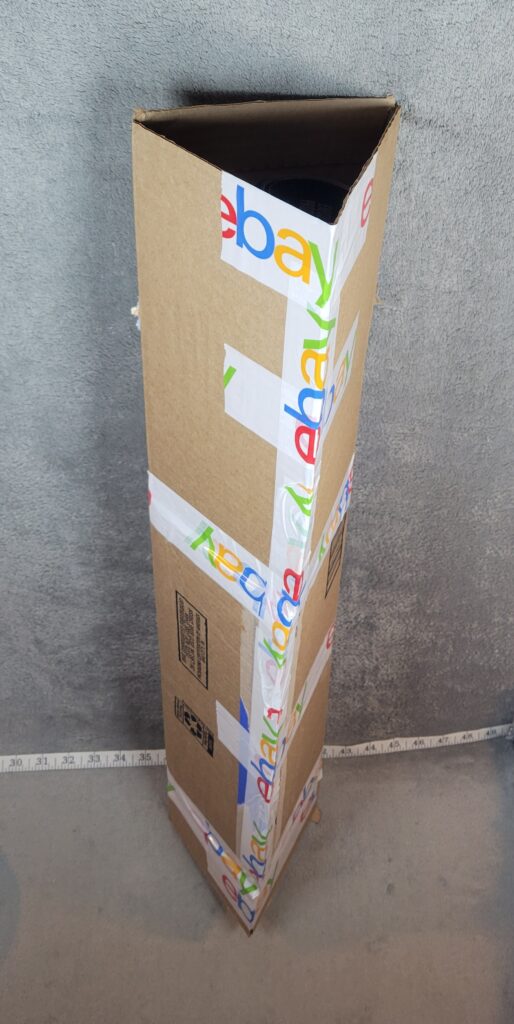 Homemade triangular cardboard shipping tube used to mail a rolled poster on eBay