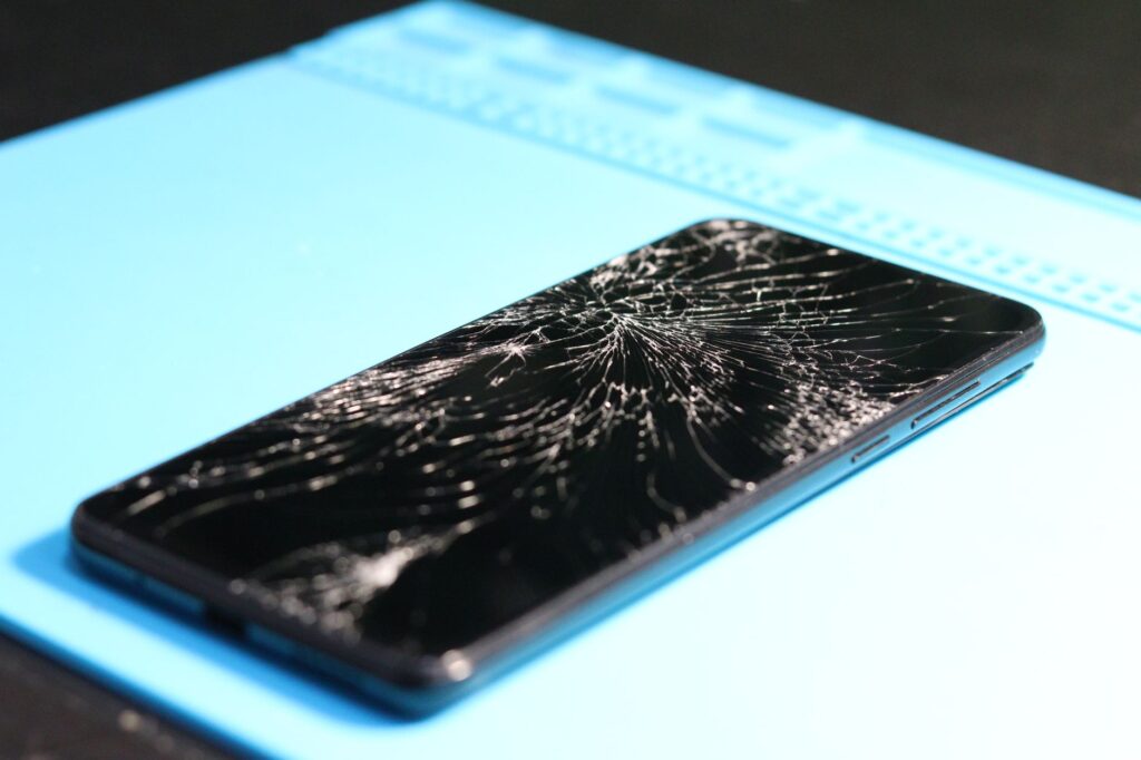 Broken electronic device being tested before listing for parts on eBay